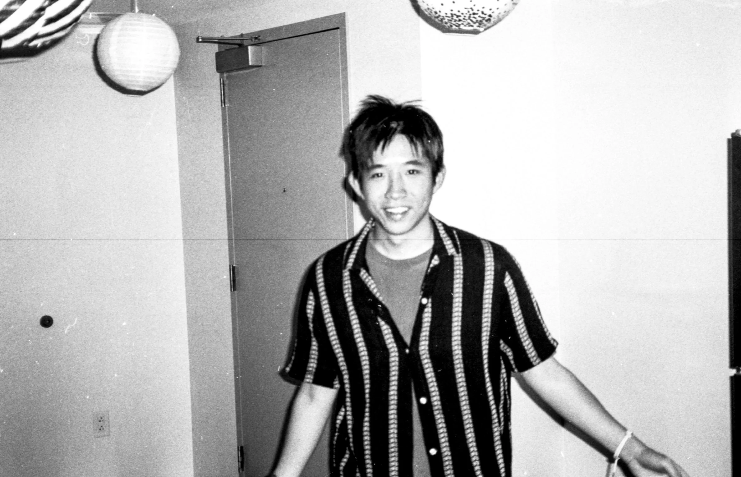 Black-and-white portrait of Kenny Qiu